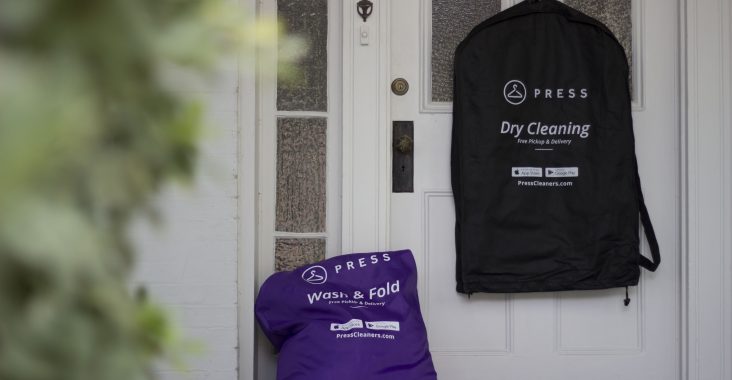 Press laundry and dry cleaning bag on doorstep